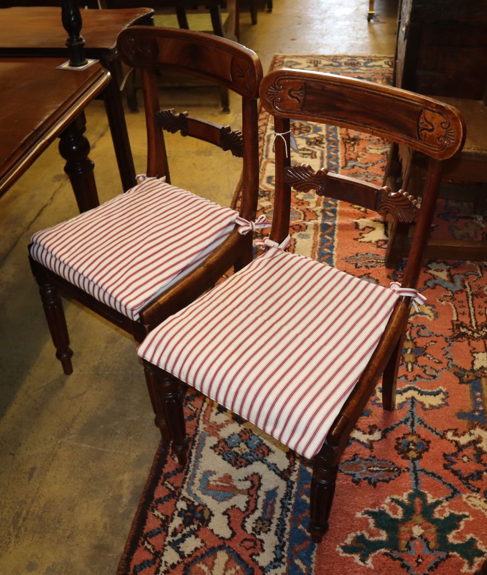 A set of seven Regency mahogany dining chairs (one having arms)